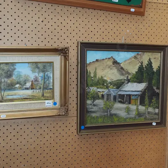 2x framed oils - cottages - blue dots - foxing to mat
