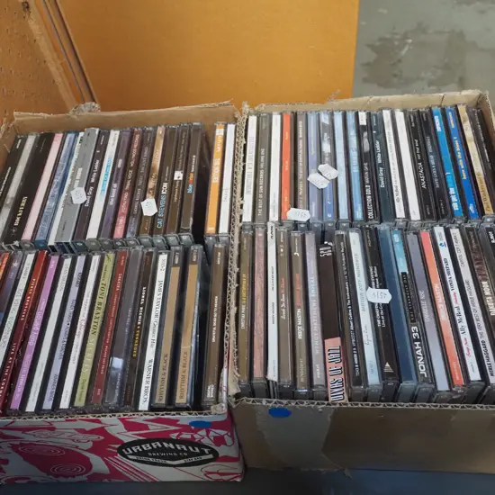 2x boxes of DVDs - blue dots