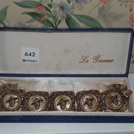 gold plated bracelet, clip on earrings