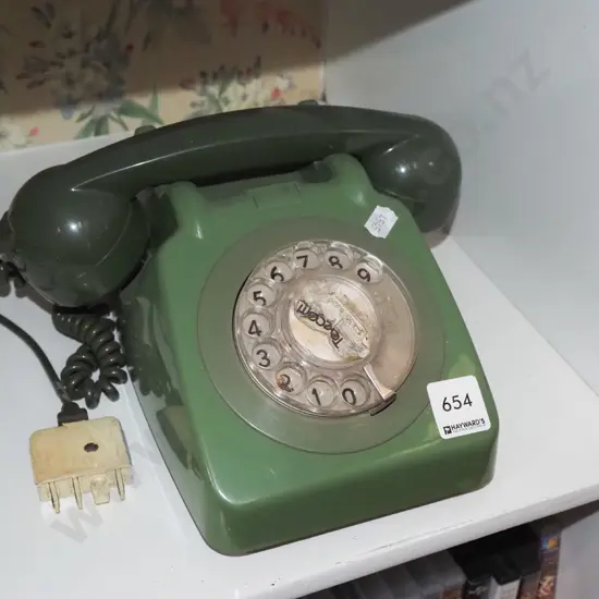 green plastic dial telephone