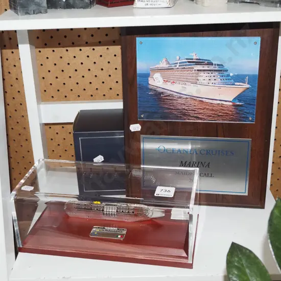 Oceania Cruises commemorative plaque and a cased model cruise ship
