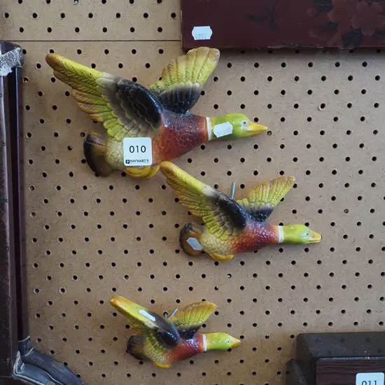 3x wall mounted flying ducks - chips, wear