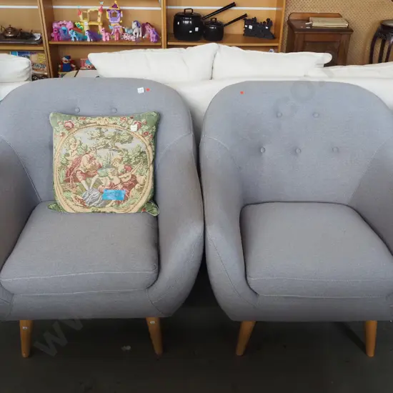 pair of conteporary grey upholstered deep buttoned armchairs - red dots