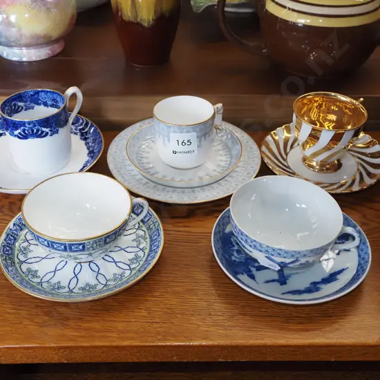 cups, saucers, trio