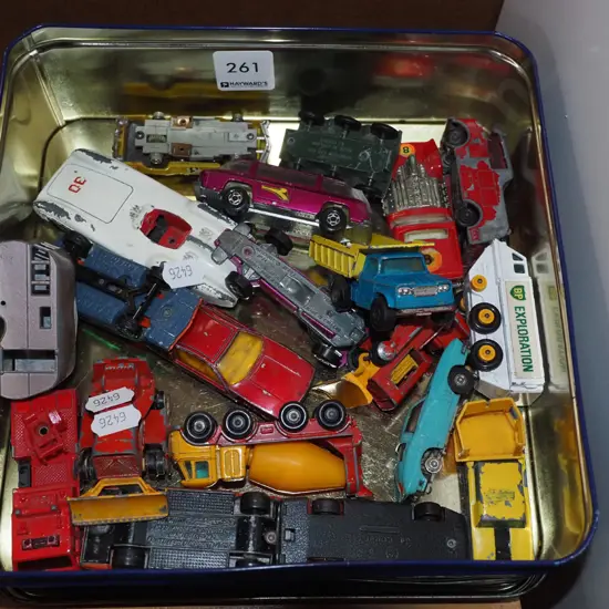 tin of model vehicles