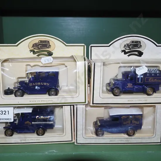 4x boxed Cadbury chocolate model vehicles - damage to boxes