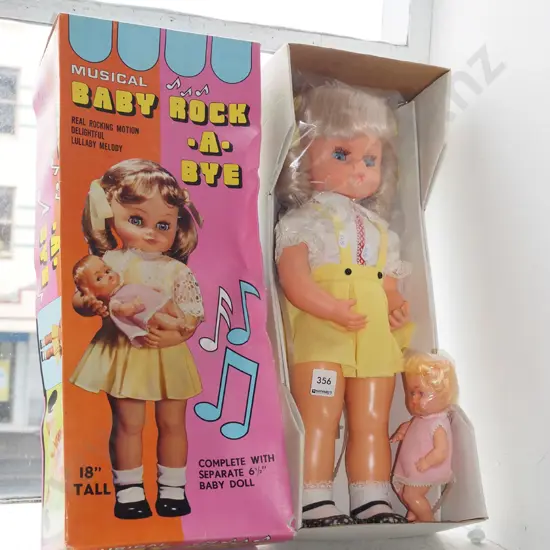 boxed; Musical Rock A Bye doll - damage to box