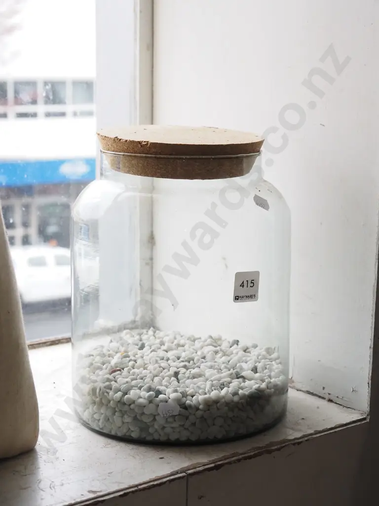 lidded canister of stones Image 1++