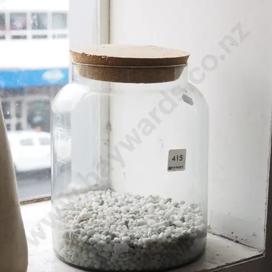 lidded canister of stones