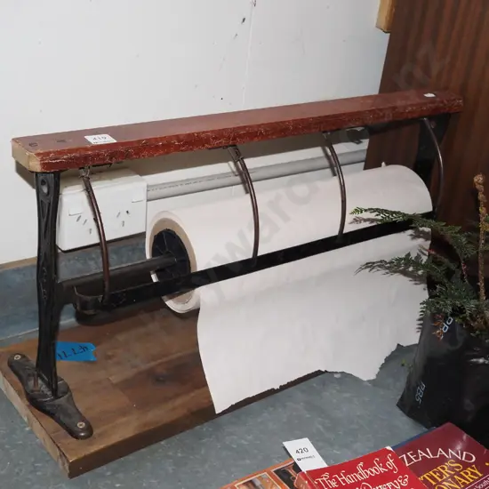 paper roll dispenser and roll of paper