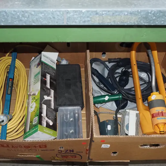 2x boxes; extension cord, rain water collector, garden sprinkler, travel iron etc