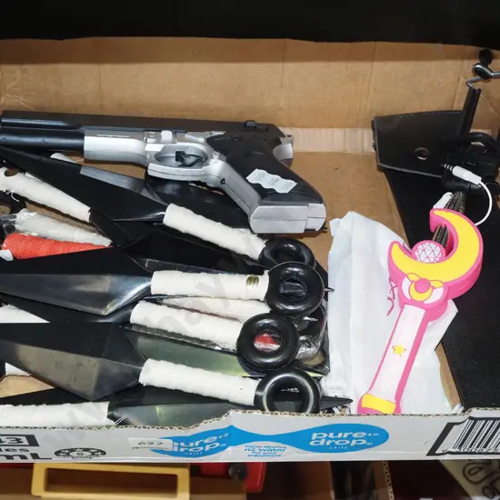 box; plastic throwing knives, magic wand selfie stick etc