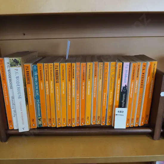 various PG Wodehouse books on a small wooden bookcase
