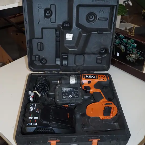 AEG 14.4V battery powered drill, 1x battery; charger - battery in office
