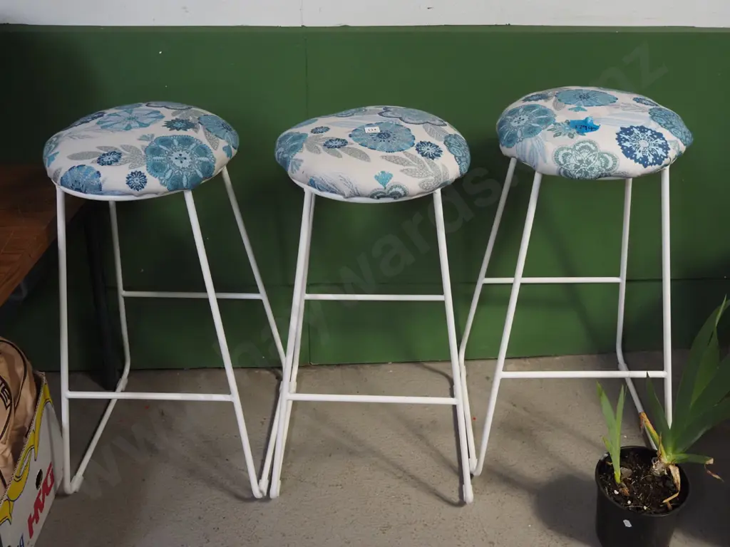 3x white metal based and blue floral upholstered bar stools Image 1++