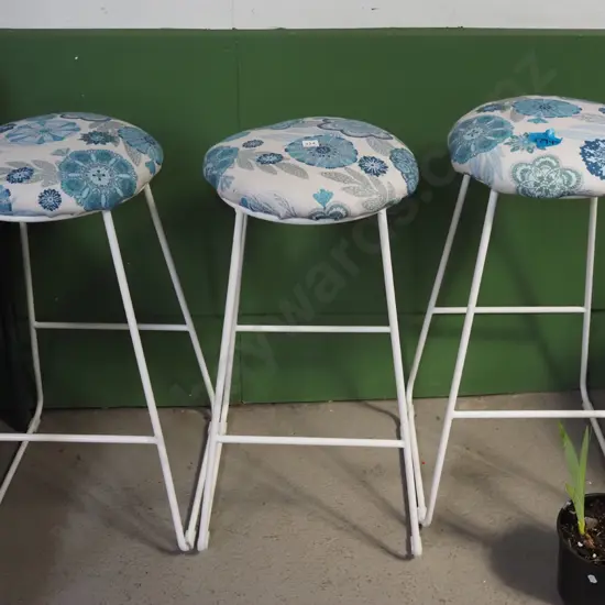 3x white metal based and blue floral upholstered bar stools