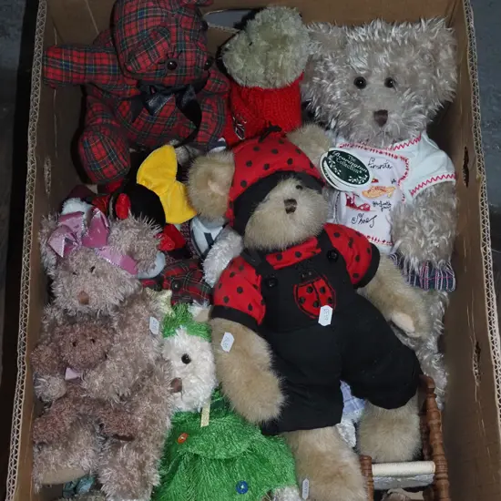 box of teddy bears and other toys