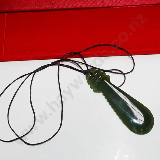 pounamu on cord in case
