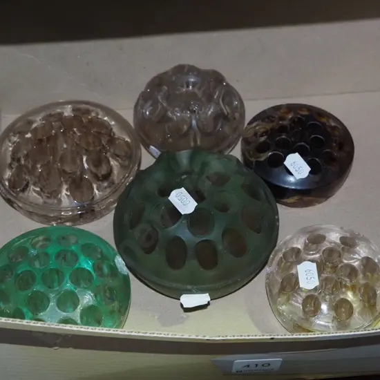 box of glass flower frogs