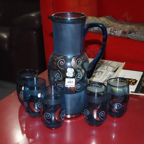 blue and silver water jug and 5 glasses