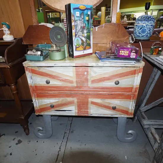 unusual hand painted 2 door chest with curved metal feet and Union Jack on front