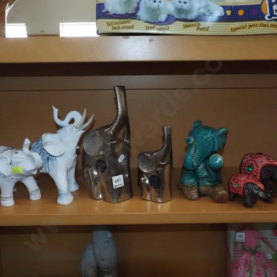shelf of elephant figurines H240