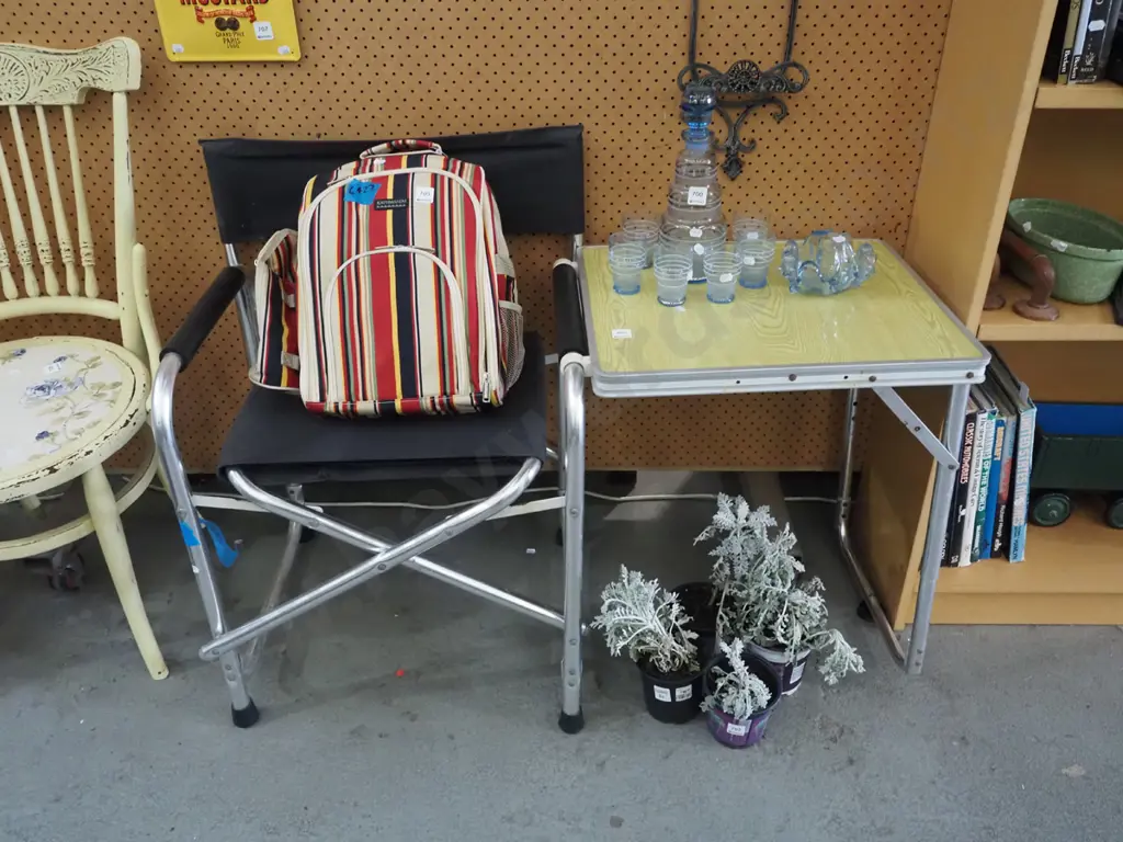 folding camping chair with latch on table Image 1++