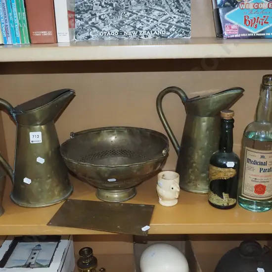 shelf; brass water jugs, parafin bottles etc