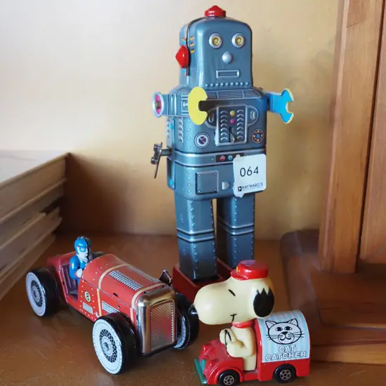 2 tin toys - robot H200 - and a Snoopy Cat Catcher vehicle