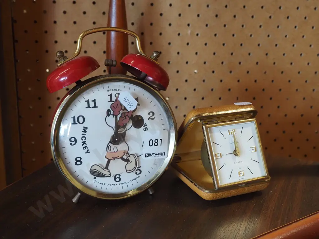 Mickey Mouse clock and a travel alarm clock Image 1++