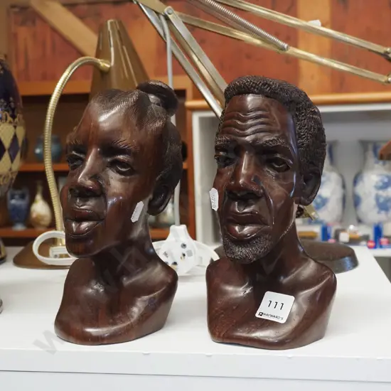 2x carved wooden heads H200