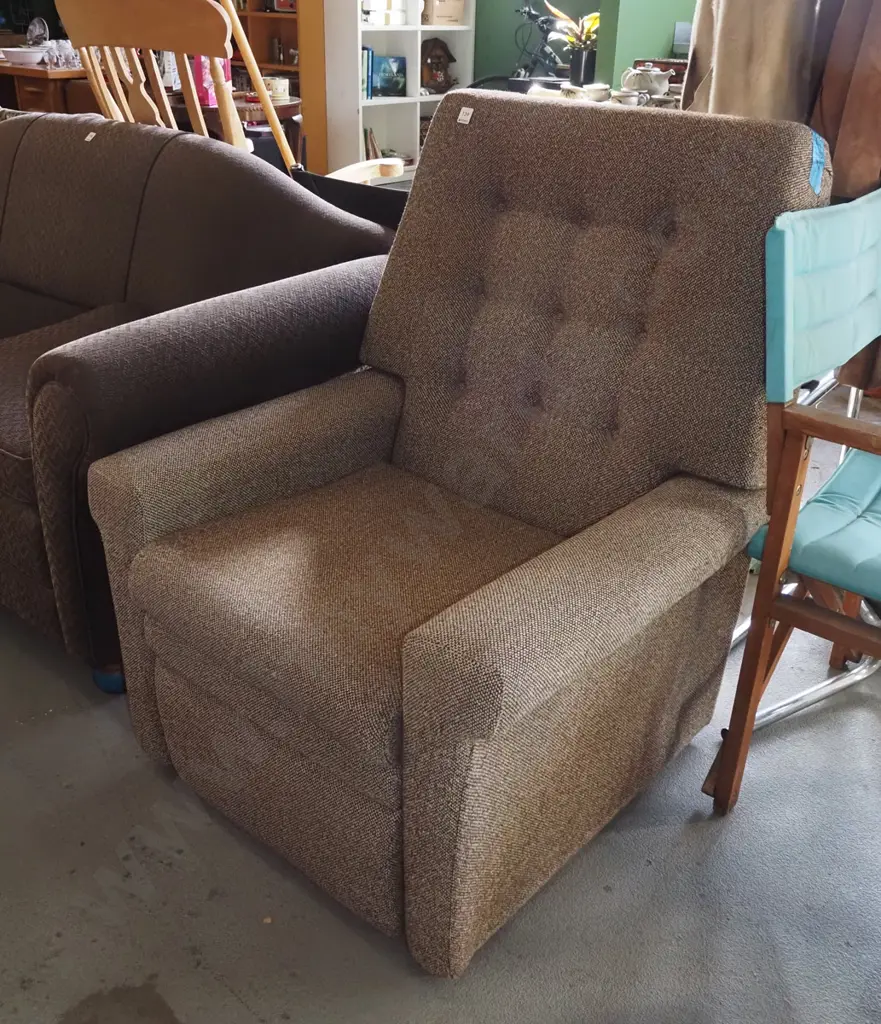 brown upholstered deep buttoned reclining armchair Image 1++