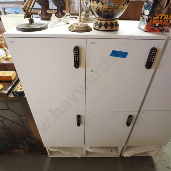 bank of 4 lockers with push button locks - code in office