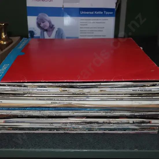 stack of LPs; Dire Straits, ABBA, Neil Diamond etc