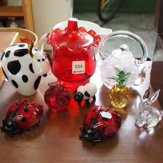 ruby glass canister, studio glass ornaments, crystal pineapple etc