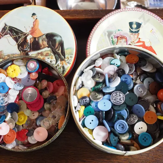 2x small tins of buttons