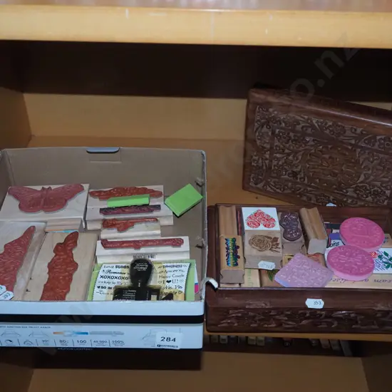 shelf of rubber craft stamps, chip carved box