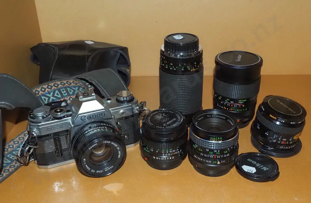 Canon AE/1 35mm camera with 5 additional lenses Image 1++