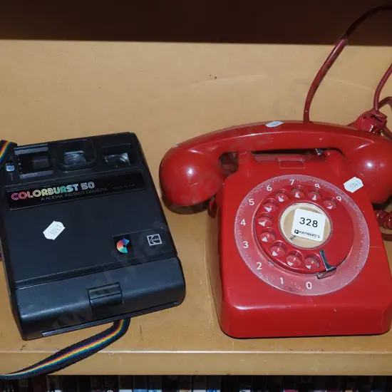 early Polaroid instant camera, red dial telephone