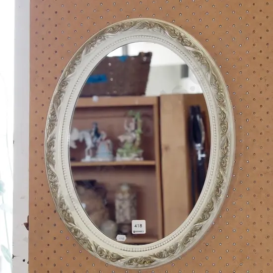ornate framed oval wall mirror