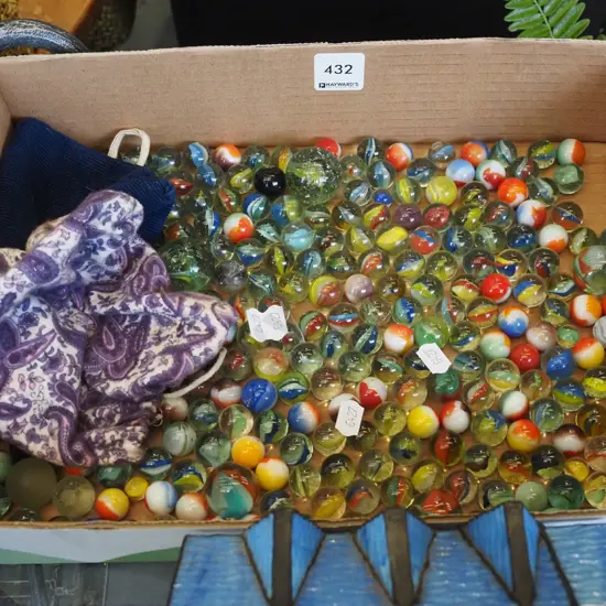 box of marbles and 2 bags