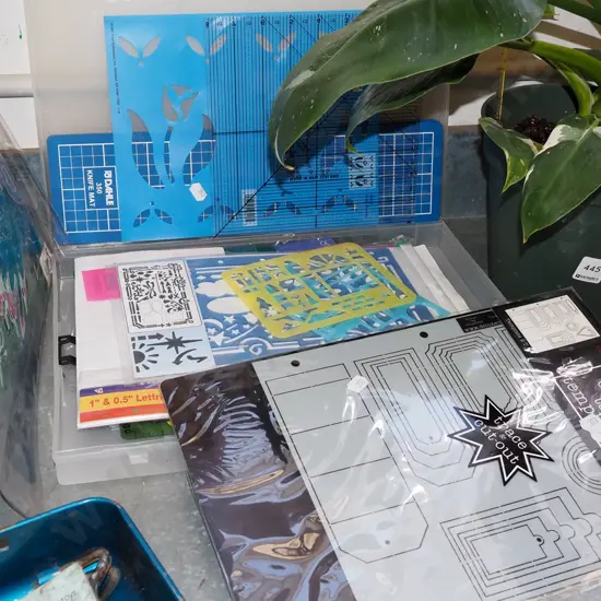 plastic case of various crafting stencils