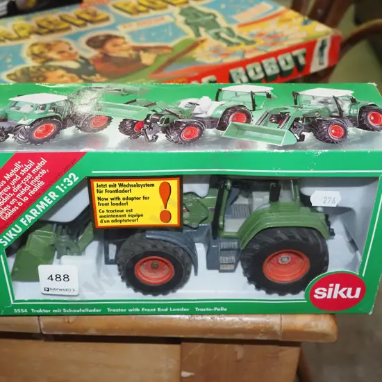 boxed diecast model of tractor with front end loader