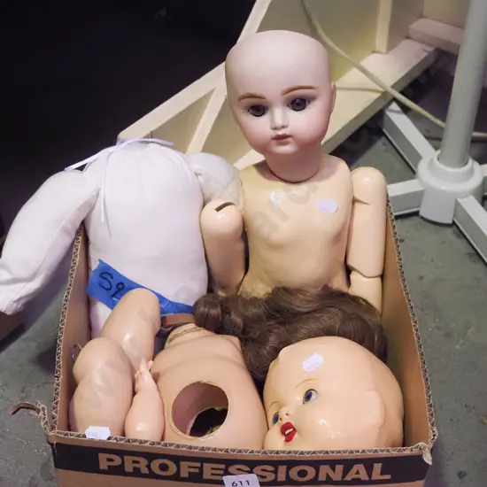 box of part dolls