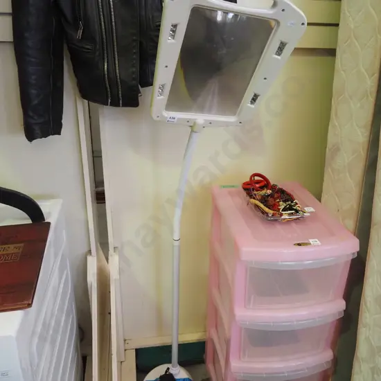 illumnated magnifying glass on stand