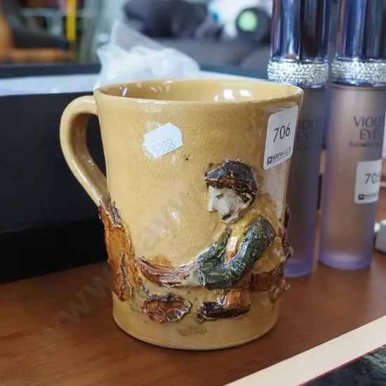 studio pottery mug - goldminer in relief