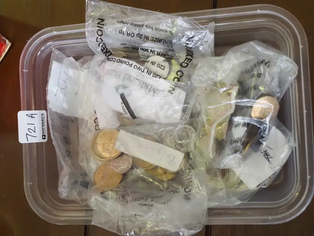 tray of assorted international coins Image 1++