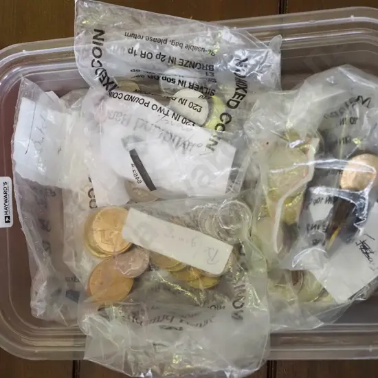 tray of assorted international coins