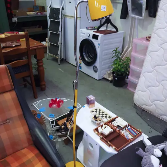 yellow adjustable standard lamp