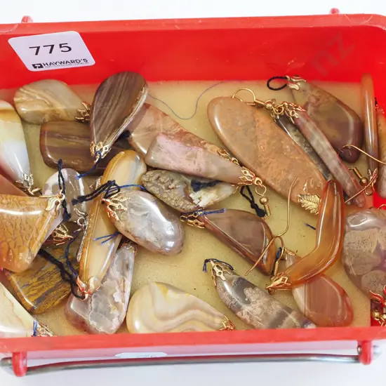 tray of polished stone earrings